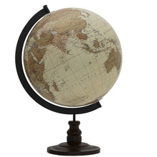 World globe on a stand with a black base against a white background