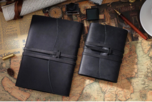 Black leather journals on a vintage map background with 'Crazy Horse Leather' text above.