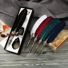 Set of feather quills with a ink bottle and decorative elements on a wooden surface.